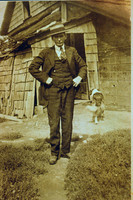 JAMES J. MULLIGAN SENIOR AT LOG HOUSE ON FARM NEAR PECK, MI.